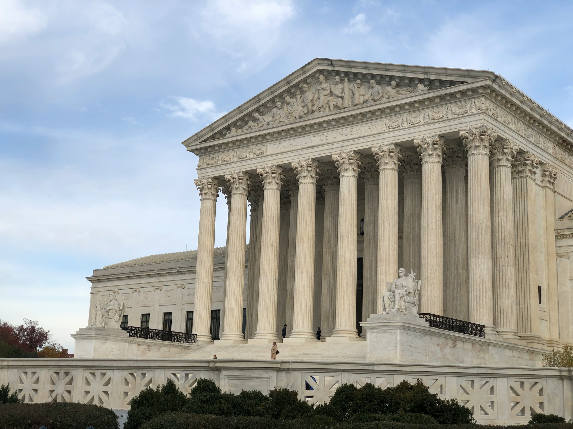 Supreme Court columns with shadowed doors closing on protesters and prisoners