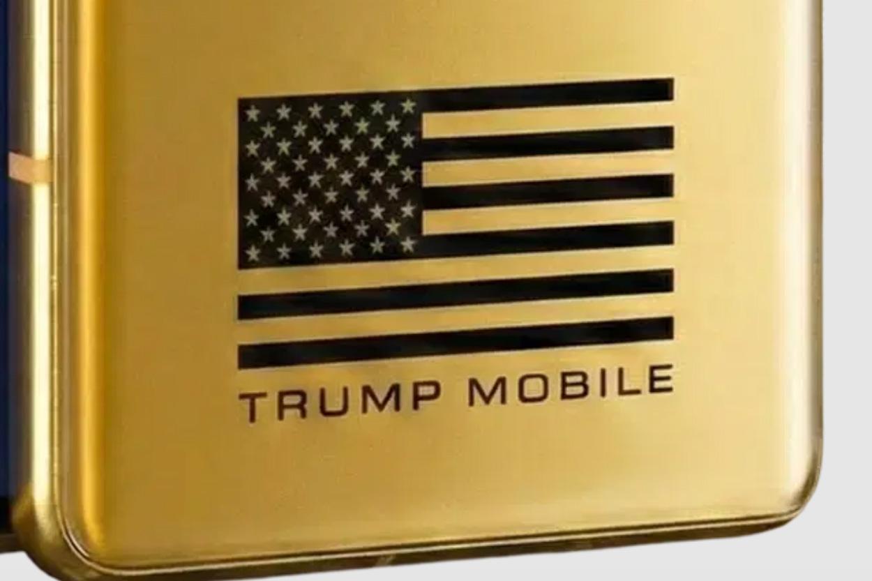 Close-up of the back of a golden smartphone showing a distorted American flag logo with fewer than 13 stripes.
