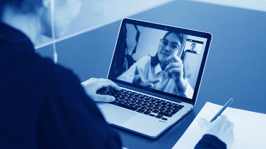 Remote worker typing on laptop at home desk with digital lock and GDPR icons overlay