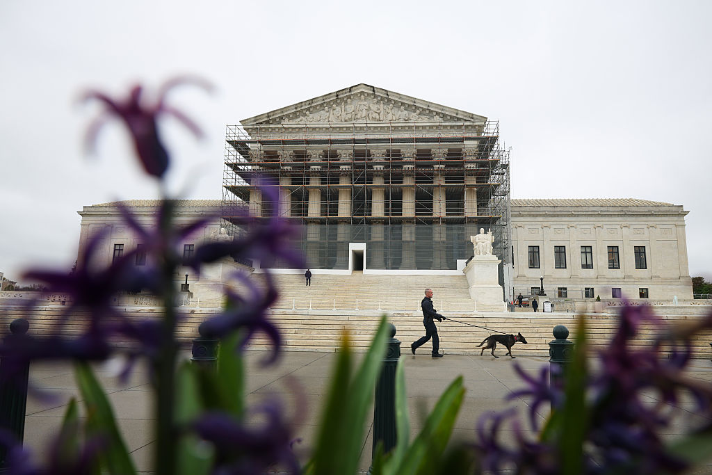 Steve Bannon leaving court with Supreme Court in background