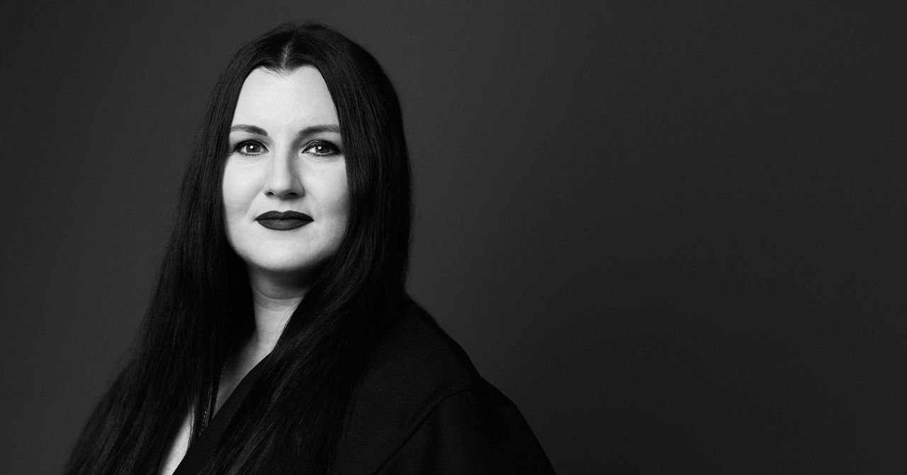 OpenAI headquarters with executive portraits amid rainy San Francisco backdrop