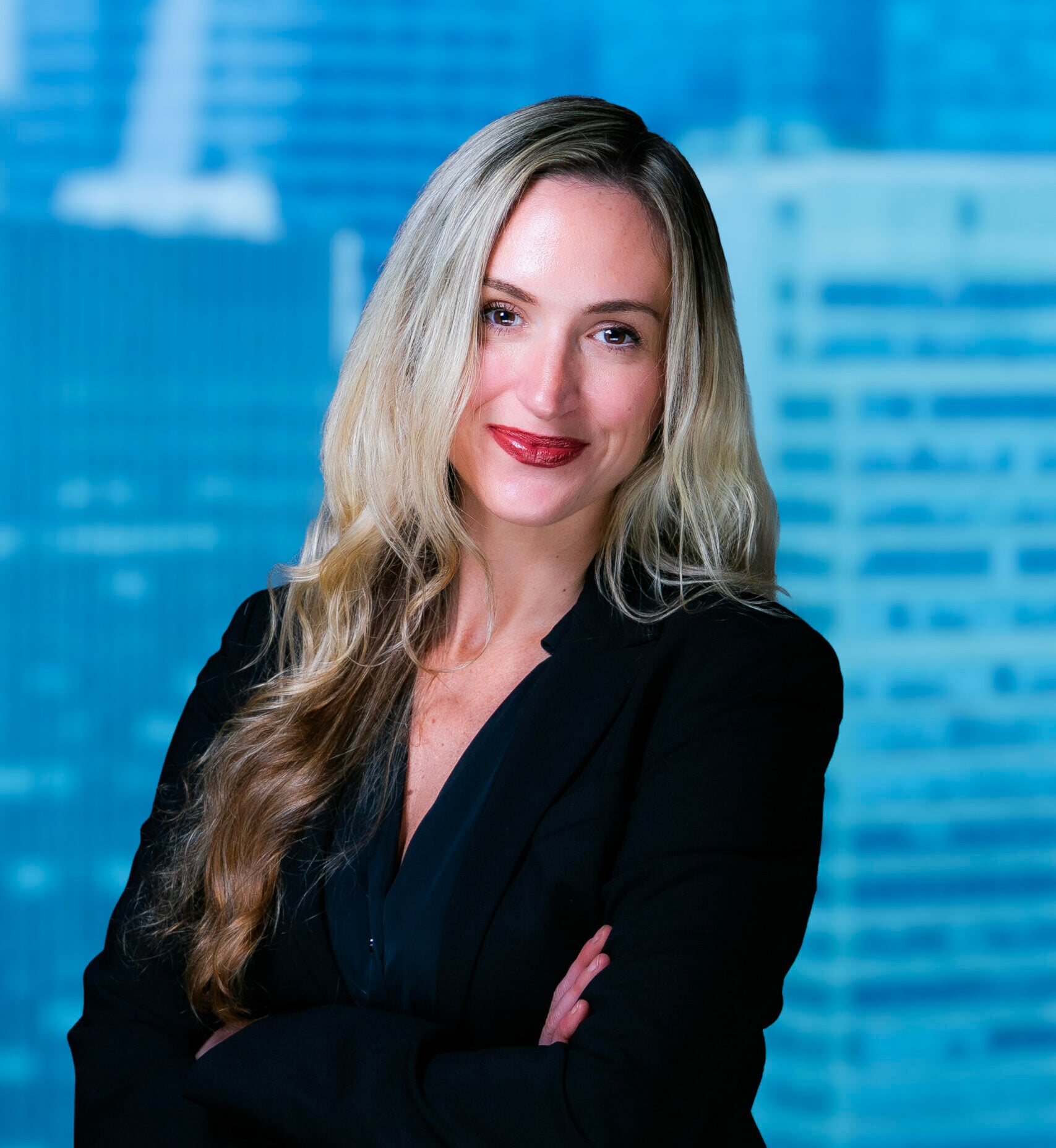 Alexandra Sadinsky, partner at Elsberg Baker & Maruri, in a modern office discussing strategy