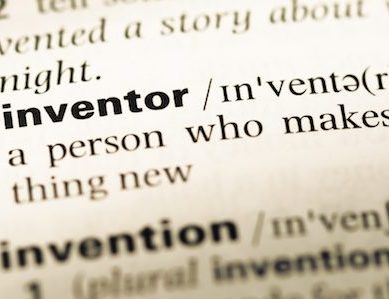 Gavel smashing a lightbulb idea sketch, symbolizing patent inventorship myths